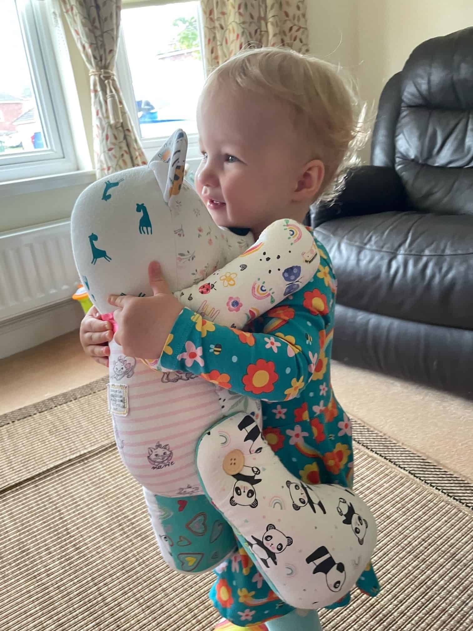 Baby with soft toy
