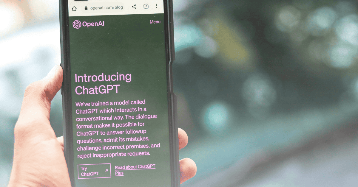 Hand holding a phone with ChatGPT on the screen, showcasing a form of GEO.